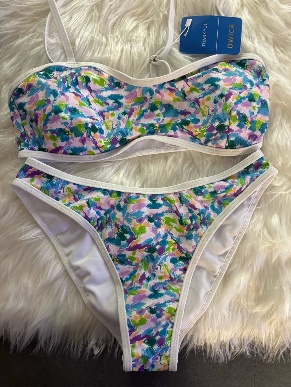 OWICA two-piece bandeau bikini featuring a vibrant abstract blue and purple